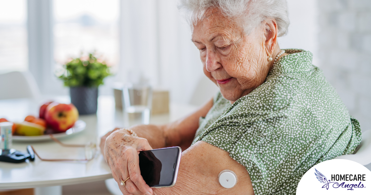 A senior woman uses her smartphone to check her glucose monitor, a tool that can be extremely helpful for diabetes care.