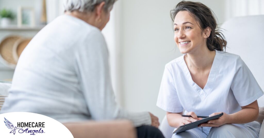 A woman smiles while with a client representing the pros of the home care industry.