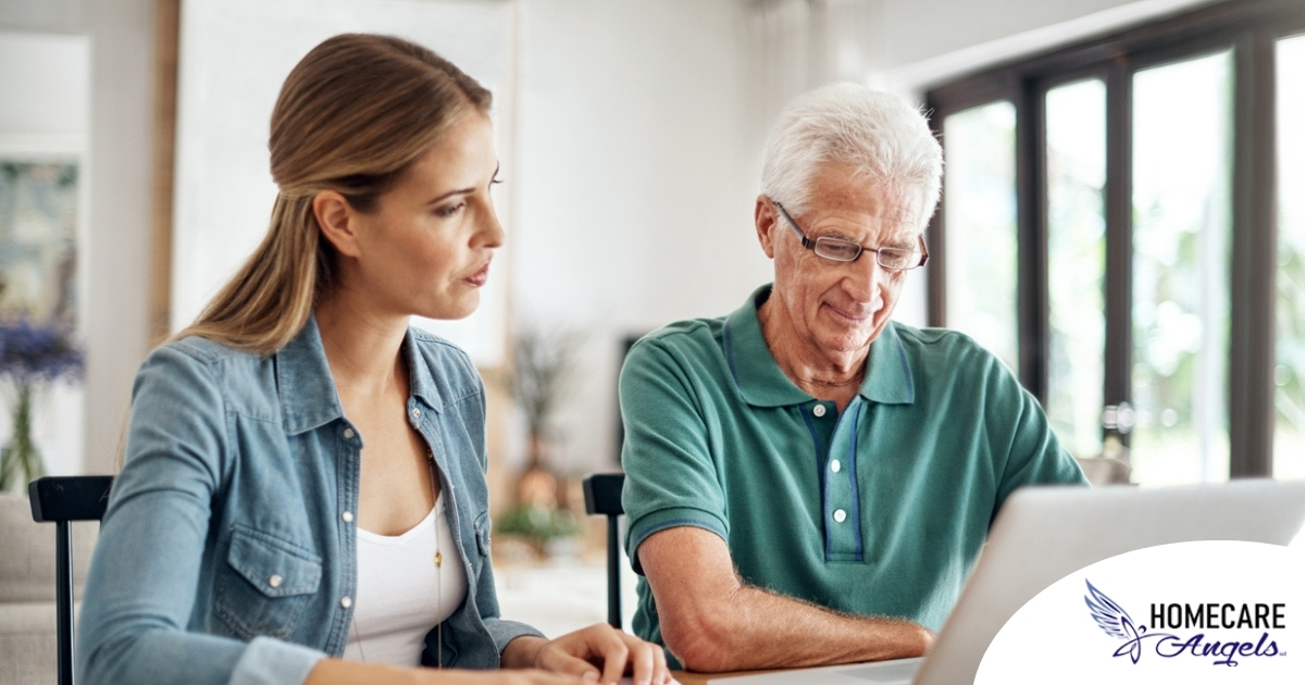 Adult daughter and senior father talking at a kitchen table while comparing home care vs assisted living